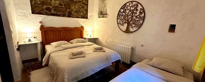 Double Room plus extra bed for 3 guests with shared bathroom